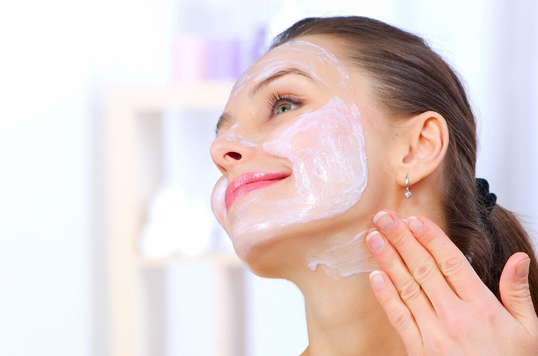 A woman rejuvenates her facial skin with a homemade mask